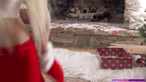 Lulu Chu and Kenzie Reeves give Rion King a cool Xmas present.