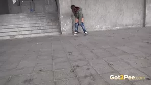 A beautiful brunette amateur enjoys solo female urination in public in high definition