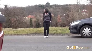 Golden shower scene with a hot brunette in a public place with piss fetish content