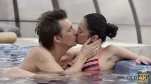 A black haired girl passionately makes love with an older man in HD